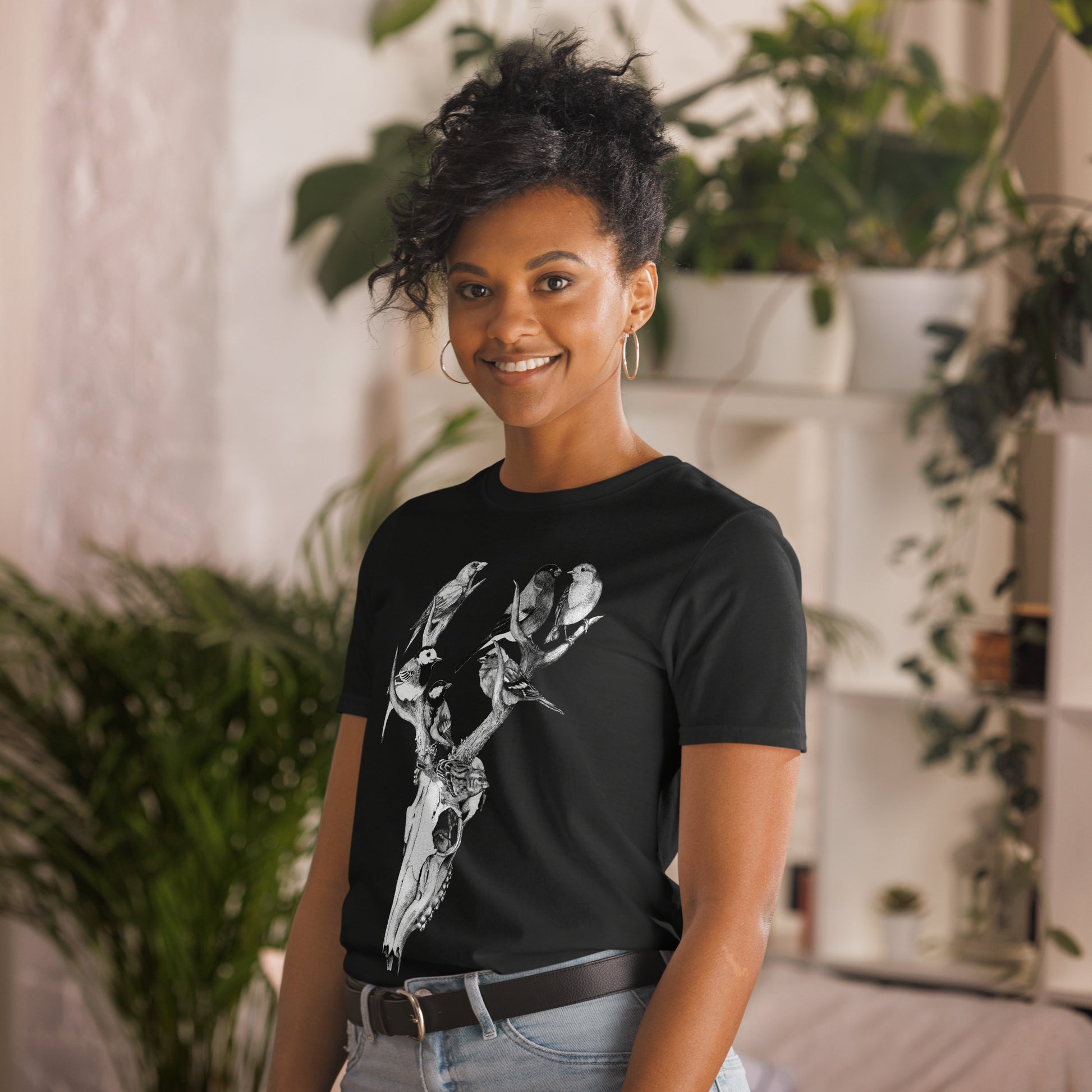 Model wearing t-shirt with black and white, tattoo inspired, gothic, witchy, pagan art.