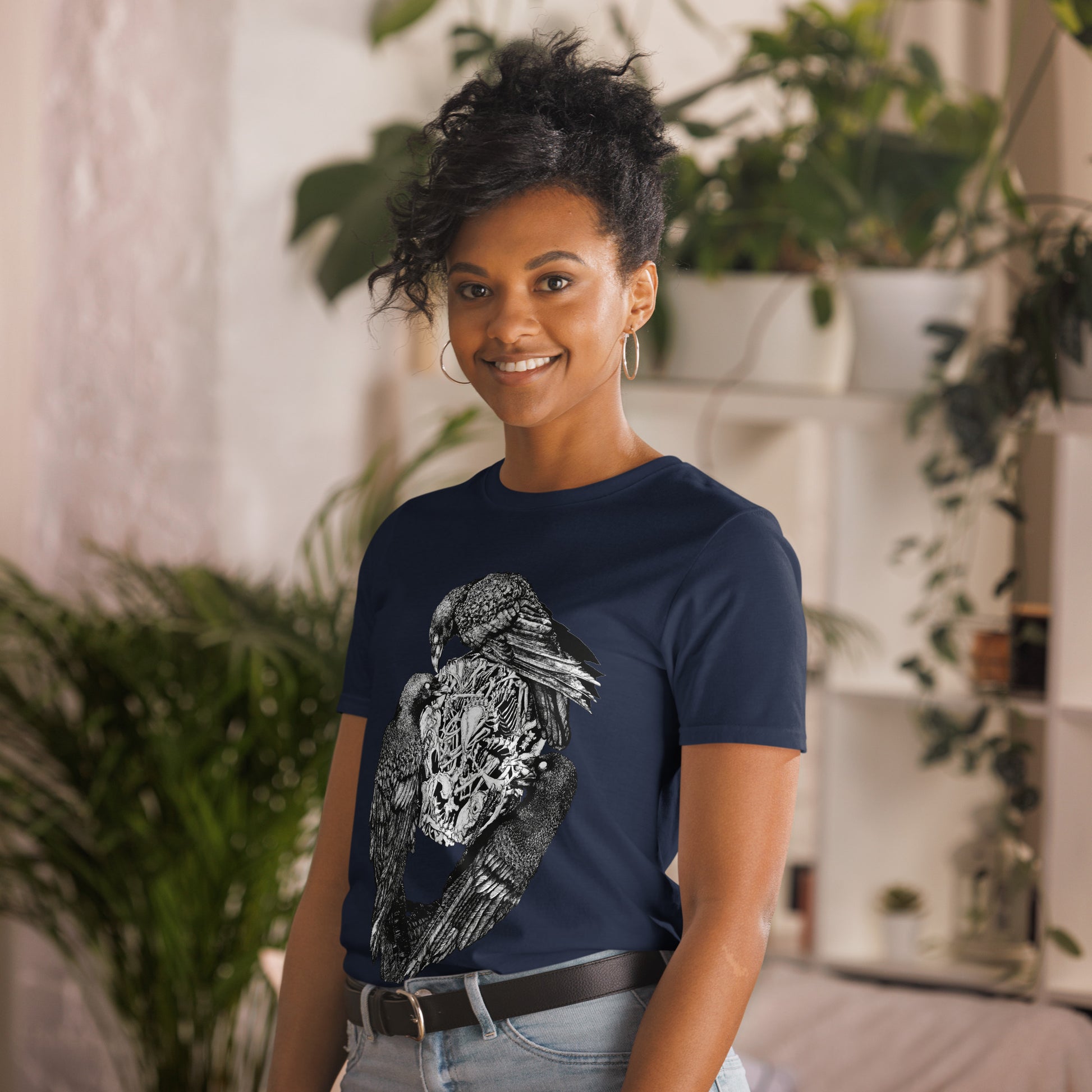 Model wearing t-shirt with black and white, tattoo inspired, gothic, witchy, pagan art.